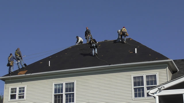 Roofers At Work